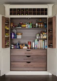 an organized pantry with lots of food in it