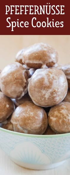 a bowl filled with donuts sitting on top of a table