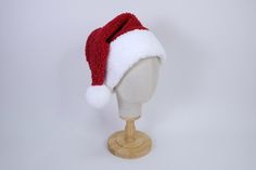 New classic cool toned red color! This Santa hat is crafted from a super soft plush faux sherpa fabric, making it the perfect accessory for all your holiday activities. Its cozy, warm texture will keep you comfortable whether you're out caroling, trimming the tree, or enjoying hot cocoa by the fire. Embrace the festive spirit while staying snug and stylish as you make holiday memories that last a lifetime. We do not accept returns or exchanges. We recommend hearing your head, and checking out our average head size chart below to help you determine your best size. We recommend choosing a hat that is 1-2" above your head measurement. We love custom orders! Please reach out via message if you would like a special size (while supplies last).  Hat Dimensions:  Adult L- 26" circumference Adult M Sherpa Fabric, Chula Vista, Fabric Making, Holiday Memories, Holiday Activities, Cool Tones, New Classic, Santa Hat, Soft Plush