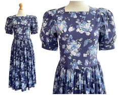 "A beautiful floral Laura Ashley dress in the most beautiful shade of blue.  In very good vintage condition, with no obvious flaws.  Bust: 32\" Waist: 28\" Hips: Free  Length: 46\" Skirt Length: 30\" ------- Vintage Frills Shop is run by Catherine, a blogger and life-long lover of all things vintage and comes from a very long line of antiques dealers, going all the way back to her great-great Grandfather and only skipping her parents' generation. Catherine used to sell vintage clothing full time Floral Tea Dress, Vintage Laura Ashley, Laura Ashley Dress, Navy And White Dress, Dress Cottagecore, Floral Tea, Laura Ashley, Tea Dress, Dress Clothes For Women