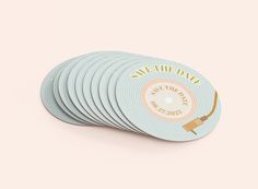 six pastel colored coasters with the words save the date printed on them