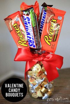 valentine's candy bouquet in a glass jar with red ribbon and chocolate candies