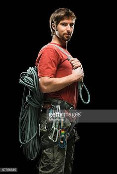 a man in red shirt holding a backpack