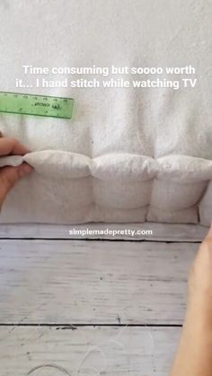 someone is measuring out the length of a pillow