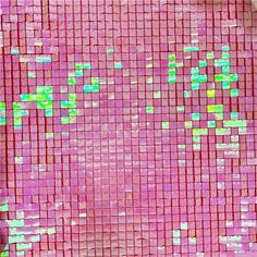 a pink and green mosaic tile with small squares