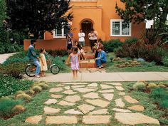 a group of people standing in front of a house