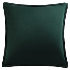 a dark green pillow on a white background