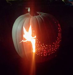 a pumpkin carved to look like it has been carved into the shape of a bird