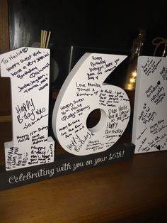 the number ten sign is decorated with handwritten words and wishes for someone's 70th birthday