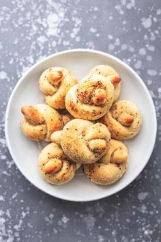 small cinnamon buns on a white plate