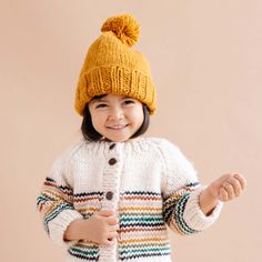 It's never too early to set your own style. Soft as can be, this pom hat will keep your little one's head warm and cozy. Whether they're taking their first steps or just rocking life, this Classic Pom hat is a must-have accessory.Crafted with care using 100% Hand-knit Acrylic. All measurements laid flat, unstretched. If unsure, size up.SIZE CHART: Extra Small 3-6 months: 14cm W x 15cm HSmall 6-24 months: 15cm W x 17cm HMedium 2-5 years: 16cm W x 19cm H Chicago Gifts, Stripe Cardigan, Baby Knitwear, Retro Rainbow, Cotton Gifts, Little Golden Books, Baby Cardigan, Pom Pom Hat, Pom Beanie