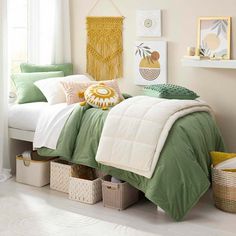 a bed with green and white comforters in a bedroom