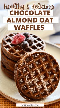 chocolate almond oat waffles with raspberries on top