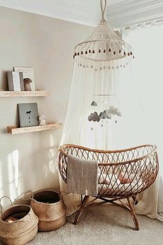 a baby crib in the corner of a room with two baskets on the floor