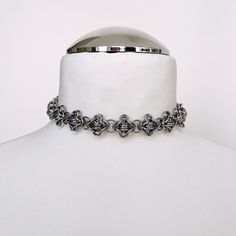 This exquisite choker necklace features a beautiful antique silver hue, crafted with strong and skin-friendly, hypoallergenic stainless steel mini jump rings. Utilizing the timeless technique of chainmail, this necklace combines durability with a touch of elegance. DETAILS: - 15 or 17 inches, jump rings, lobster clasp. - Perfect for every day wear or as a gift - This necklace is made with stainless steel, which is non tarnishing and considered hypoallergenic. Stainless steel and steel plated care: - To store the product, please make sure it's dry and place it in the included air- tight box. - Avoid chemicals, salt and swimming with the product. Chainmail Patterns, Chainmail Jewelry, Chain Mail, Choker Necklaces, Jump Rings, Lobster Clasp, Antique Silver, Ukraine, Choker Necklace