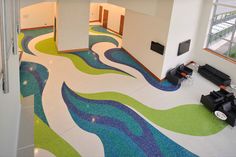 an aerial view of a living room with colorful flooring