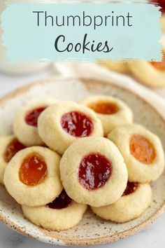 small peanut butter and jelly thumb cookies on a plate with the title text overlay