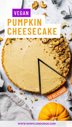 vegan pumpkin cheesecake on a white table with oranges