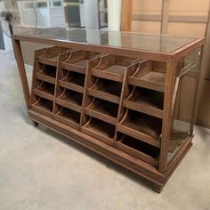 a wooden shelf filled with lots of drawers