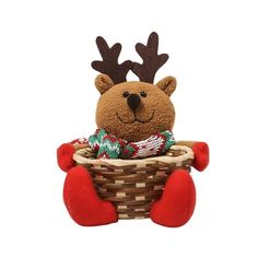 a stuffed animal with antlers sitting in a basket