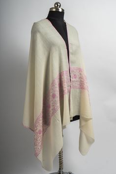 Embrace the pure elegance of our Snow White Hand Embroidered Merino Wool Sozni Scarf, a testament to the artistry of Kashmiri craftsmanship. Woven from the softest merino wool, this scarf features a pristine ivory base highlighted by delicate pink sozni embroidery. The intricate floral and vine motifs add a touch of femininity and grace, making it a versatile accessory for any wardrobe. This exquisite scarf is perfect for adding a layer of luxury to your outfit, whether you are dressing up for a Sozni Embroidery, Embroidered Rug, Scarf Jacket, Embroidered Handbag, Pink Embroidery, Refined Aesthetic, Silk Carpet, Pure Elegance, Pashmina Shawl