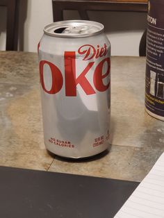 a can of diet coke sitting on top of a counter