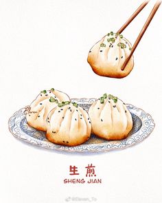 three steamed dumplings on a plate with chopsticks