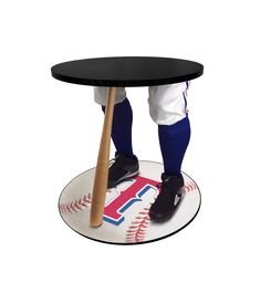 a baseball player holding a bat on top of a table