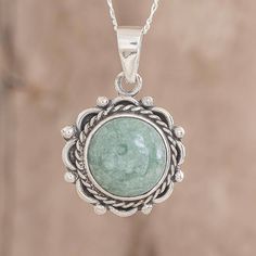 Resembling the sun as it rises over Antigua Guatemala a round cabochon of apple green jade is framed by sterling silver patterns at the center of a lovely link necklace. The renowned Jimenez Family creates the necklace circling the neck with sterling Figaro chain. Round Cabochon Pendant, Silver Neckalce, Jade Pendant Necklace, Silver Jewelry Design, Jade Necklace, Figaro Chain, Moon Jewelry, Cabochon Pendant, Natural Jade