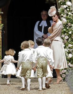 the duke and princess of cambridge with their children at an official wedding ceremony in england