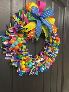 a brightly colored wreath on the front door