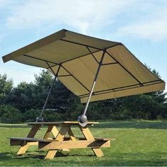 an upside down picnic table in the middle of a field