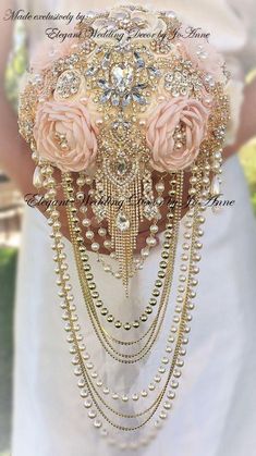 a bridal bouquet with pink roses and pearls