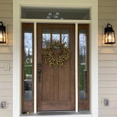 Black Craftsman Double Front Door, Farmhouse Look Exterior, Wood Look Front Door With Sidelights, Modern Farmhouse Exterior Door Entrance, Farmhouse Exterior Doors Entrance, Front Door Wall Lights, Ranch House Outdoor Lighting, Front Door Inspiration Farmhouse, Back Door Styles