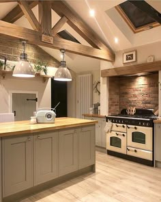 a kitchen with an oven, stove and counter top in it's center area