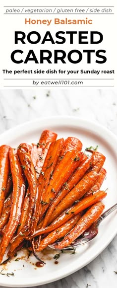 roasted carrots on a white plate with a fork