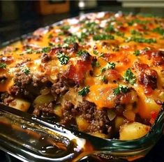 a casserole dish with meat, potatoes and cheese