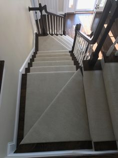 a staircase with carpeted steps leading up to the door