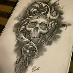 a drawing of a skull with flowers on it