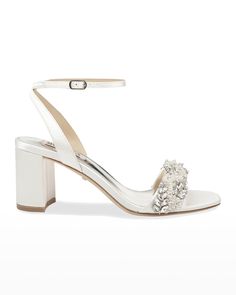 a women's white high heeled sandal with flower decoration on the ankle