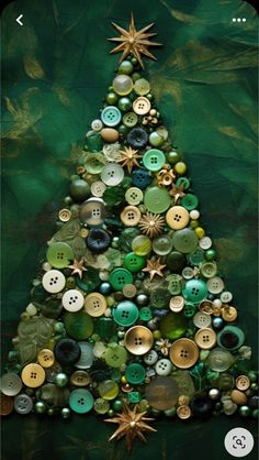 a christmas tree made out of buttons on a green background