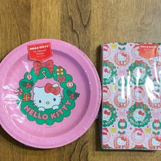 a hello kitty paper plate next to a package