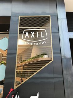 an advertisement for axl coffee roasters on the side of a building