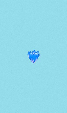 a blue heart shaped object floating in the air on top of a blue sky background