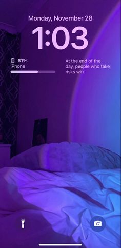 an iphone screen showing the time for someone to wake up in bed with their phone