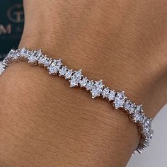 6.10 Carat Diamond Tennis Bracelet, Marquise Cut Lab Grown Diamond Pave Set Bracelet, 14k White Gold Bracelet for Her ✤ Center Stone Details:   - 𝐂𝐮𝐬𝐭𝐨𝐦𝐢𝐳𝐞: Yes - 𝐂𝐡𝐚𝐢𝐧/ 𝐍𝐞𝐜𝐤𝐥𝐚𝐜𝐞 𝐓𝐡𝐢𝐜𝐤𝐧𝐞𝐬𝐬:  - 𝐌𝐞𝐭𝐚𝐥: 925 Silver / 10K Gold / 14k Gold - 𝐒𝐭𝐨𝐧𝐞: Lab Grown Diamond - 𝐂𝐥𝐚𝐫𝐢𝐭𝐲: VVS - 𝐂𝐨𝐥𝐨𝐫: D-E-F - 𝐂𝐮𝐭: Very Good - 𝐏𝐨𝐥𝐢𝐬𝐡: Excellent - 𝐂𝐨𝐧𝐝𝐢𝐭𝐢𝐨𝐧: New ↦ Making Process: Handmade - Crafted by our experienced team Diamond Shape : Marquise Cut  Diamond Total Weight: 6.10cts + Metal Weight: 13.30 grams Each Diamond Weight: .35ct -.40ct. each Diamond Color: DEF Diamond Clarity: VS+ ➥ Metal Metal:  Silver / Gold Yellow gold ( 10kt / 14kt) Rose gold ( 10kt / 14kt) White Gold ( 10kt / 14kt) ✤𝐏𝐫𝐨𝐝𝐮𝐜𝐭𝐢𝐨𝐧   - All items are made to Luxury Diamond White Diamond Cut Chain Bracelet, Luxury Lab-grown Diamond Engagement Bracelet, Luxury Marquise Cut Bracelets For Anniversary, Luxury Marquise Diamond Bracelet For Anniversary, Luxury Marquise Diamond Cut Bracelets, Luxury Marquise Cut Diamond Bracelet For Anniversary, Luxury Marquise Cut Diamond Bracelet For Formal Occasions, Luxury Marquise Cut Diamond Bracelet For Formal Events, Luxury Wedding Diamond Bracelet With Marquise Cut