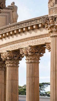 an arch in the middle of two stone pillars