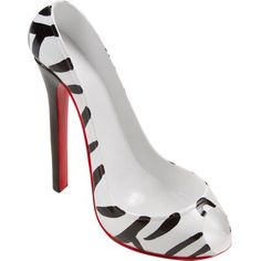 a white and black high heel shoe with zebra print