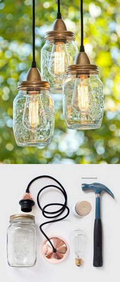 three mason jar lights are hanging from the ceiling, and one light is plugged in