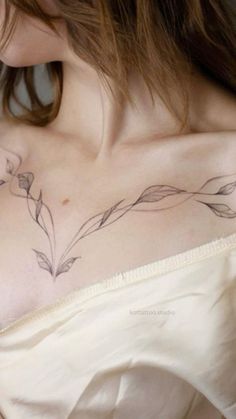 a woman with a tattoo on her chest